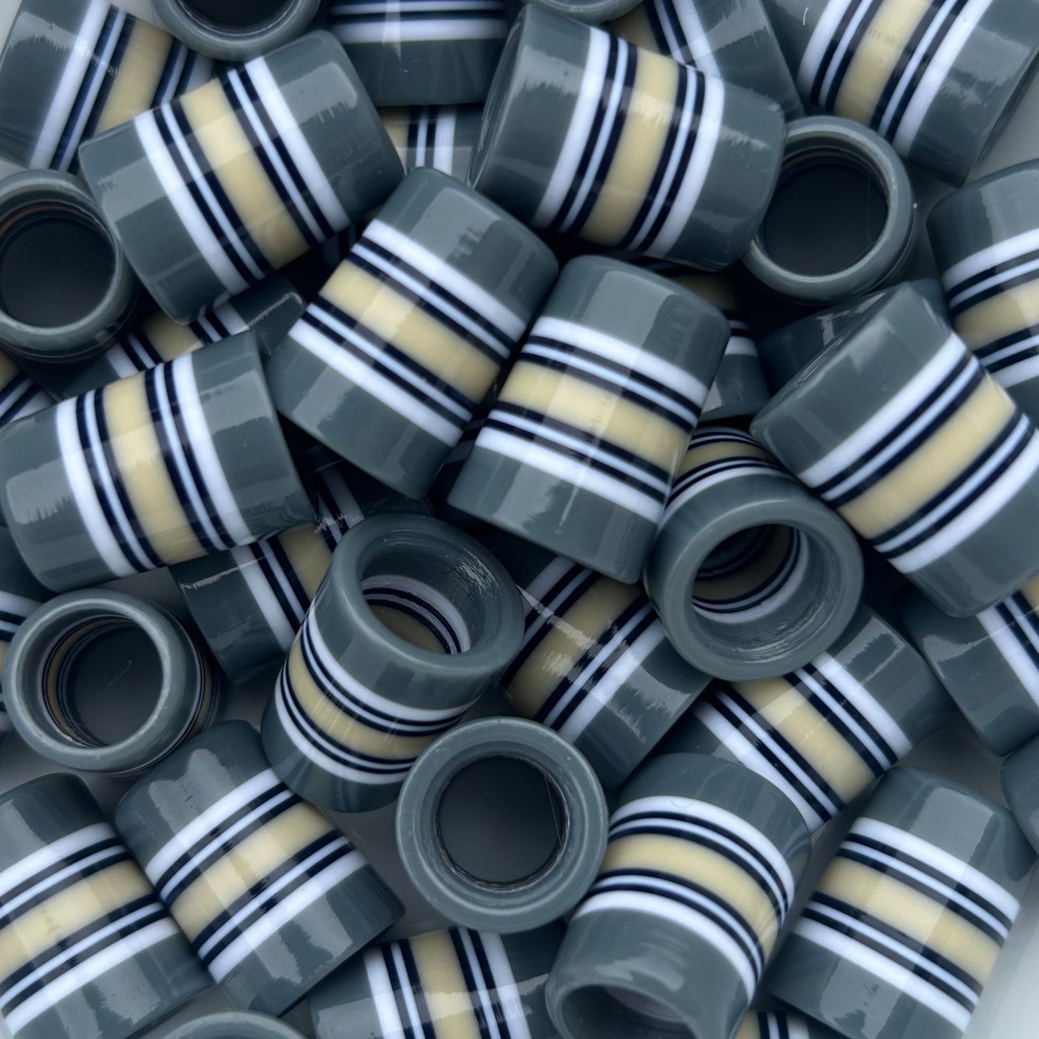 gray golf ferrules with white, navy, and creamy yellow stripes