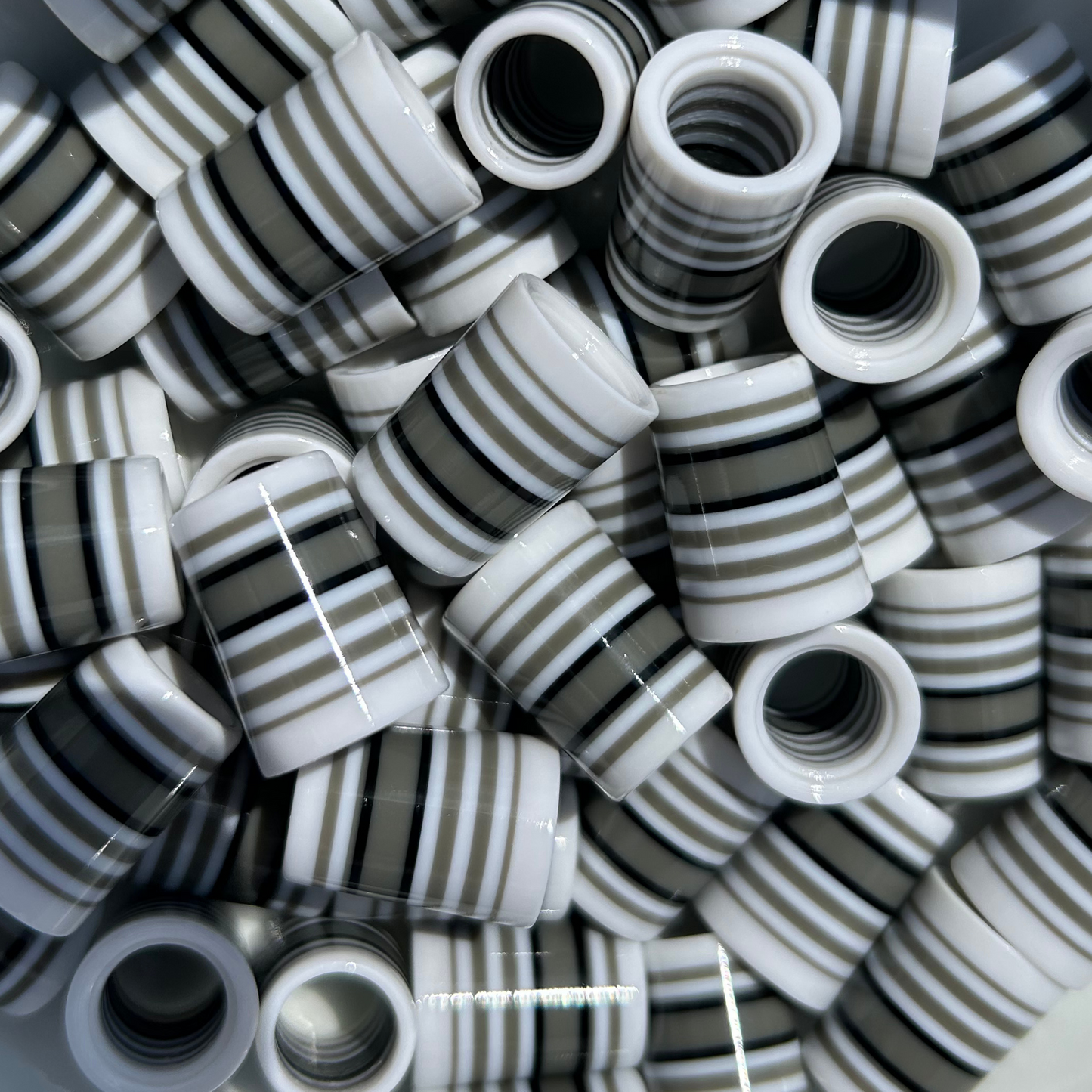 white golf ferrules with black and limestone gray stripes