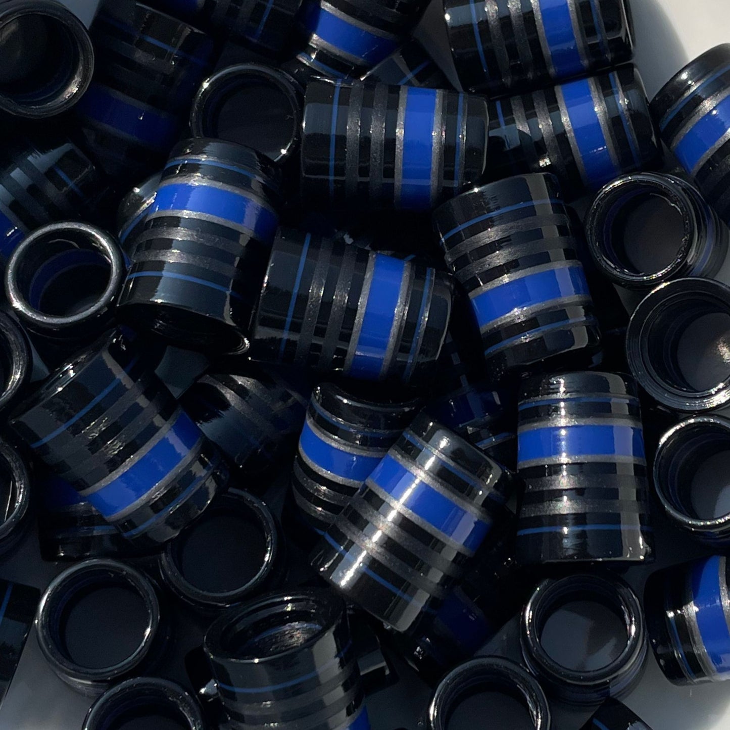 Matte black and glossy black custom golf ferrules with a royal blue stripe