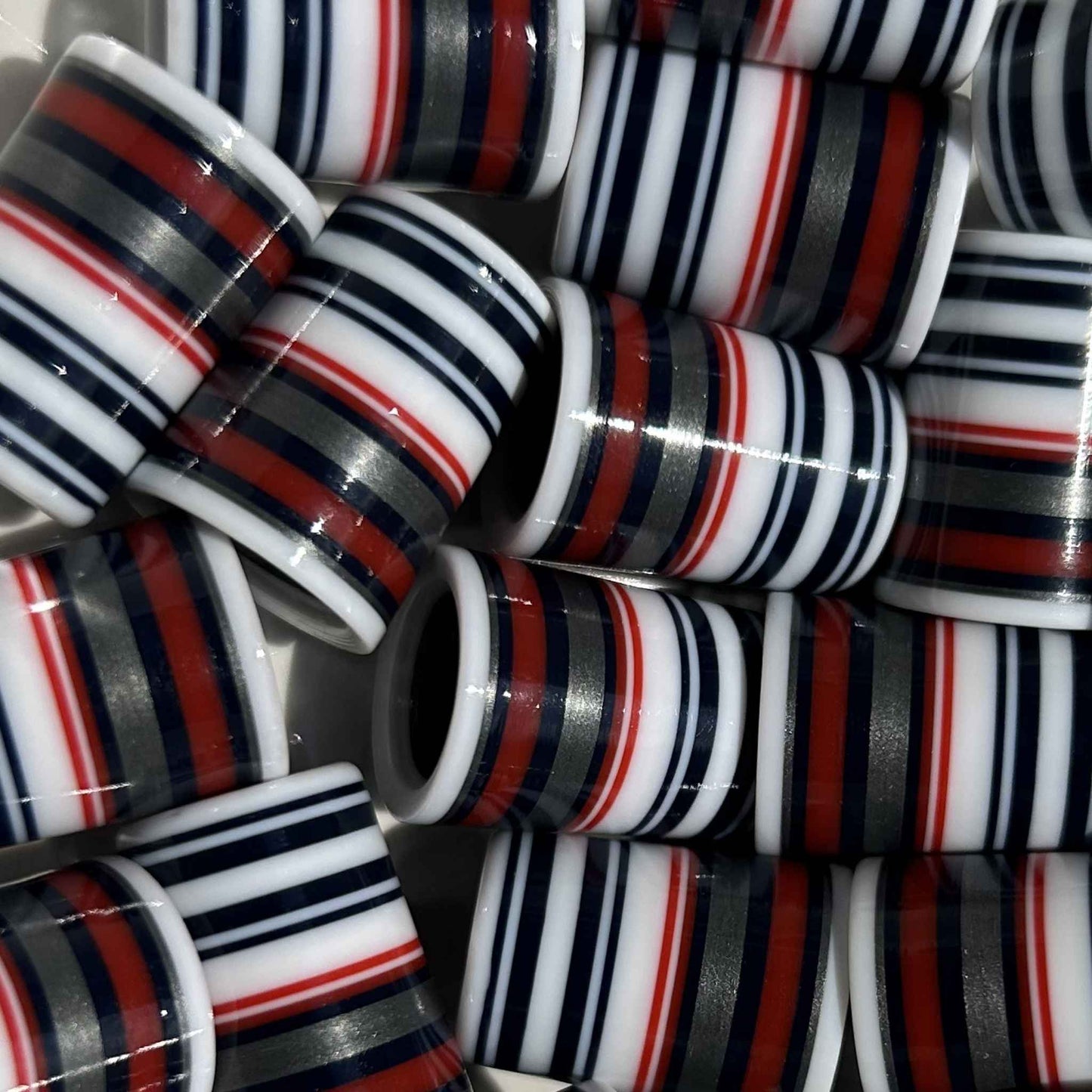 red, black, silver, and white golf ferrules