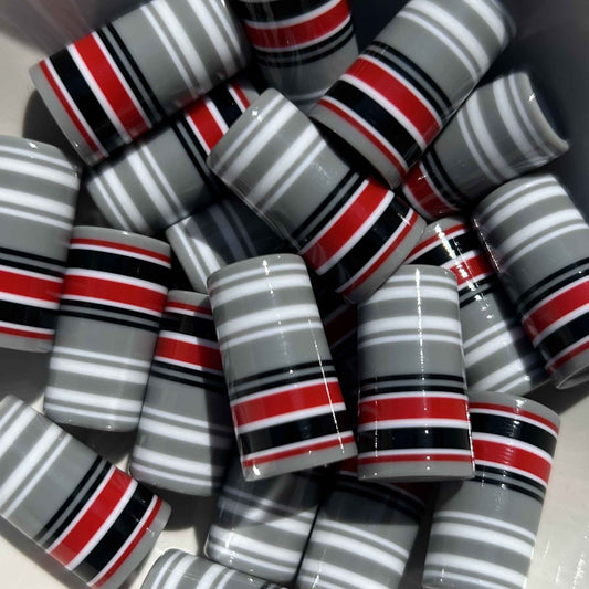 red, white, black, and gray striped 1" ferrules