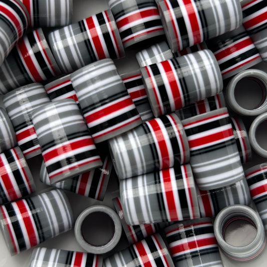 gray, white, black, and red golf ferrules