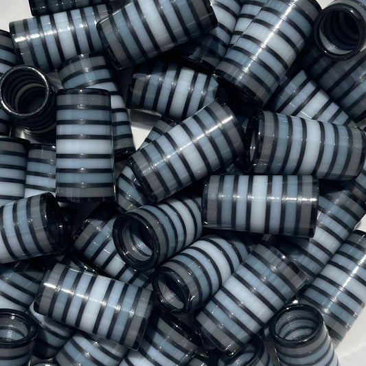 Custom golf ferrules striped in various shades of gray with matte black stripes separating each color