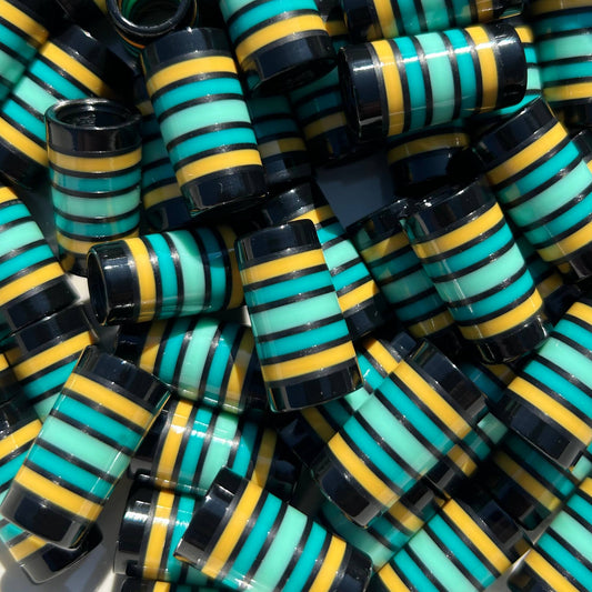 Stack of black, yellow, teal, and mint green striped custom golf ferrules