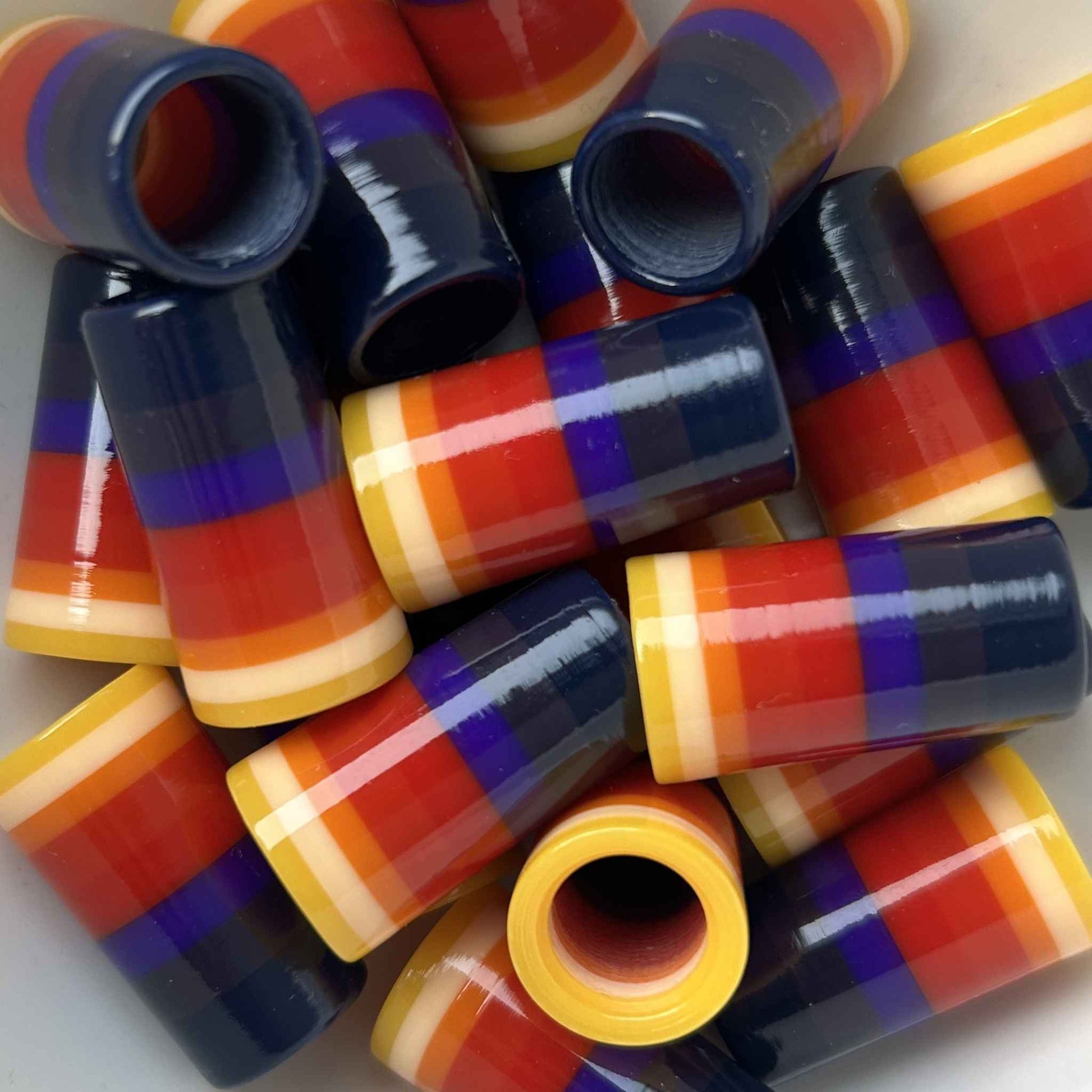 purple, yellow, orange, and red golf ferrules
