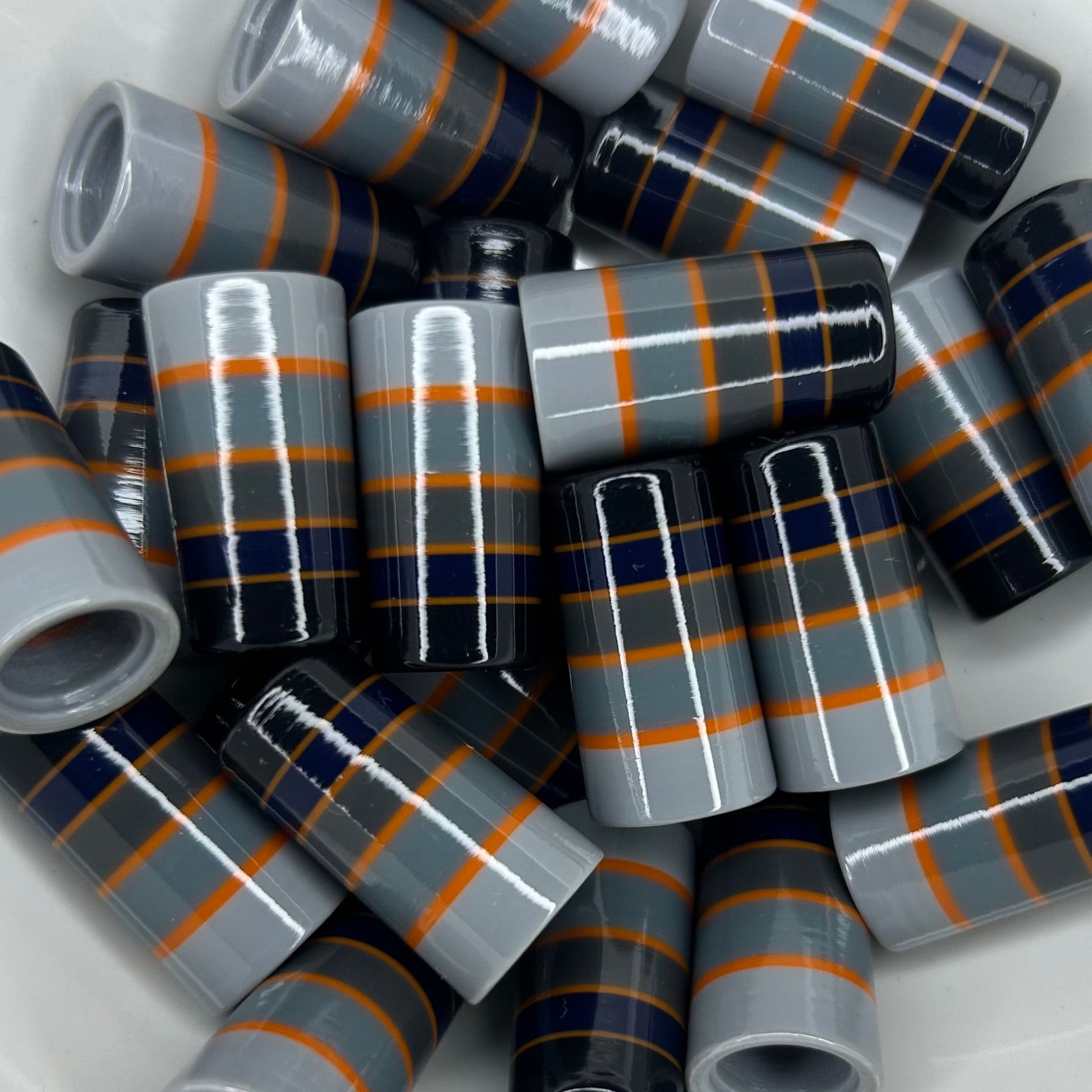 black, navy blue, gray, and orange golf ferrules