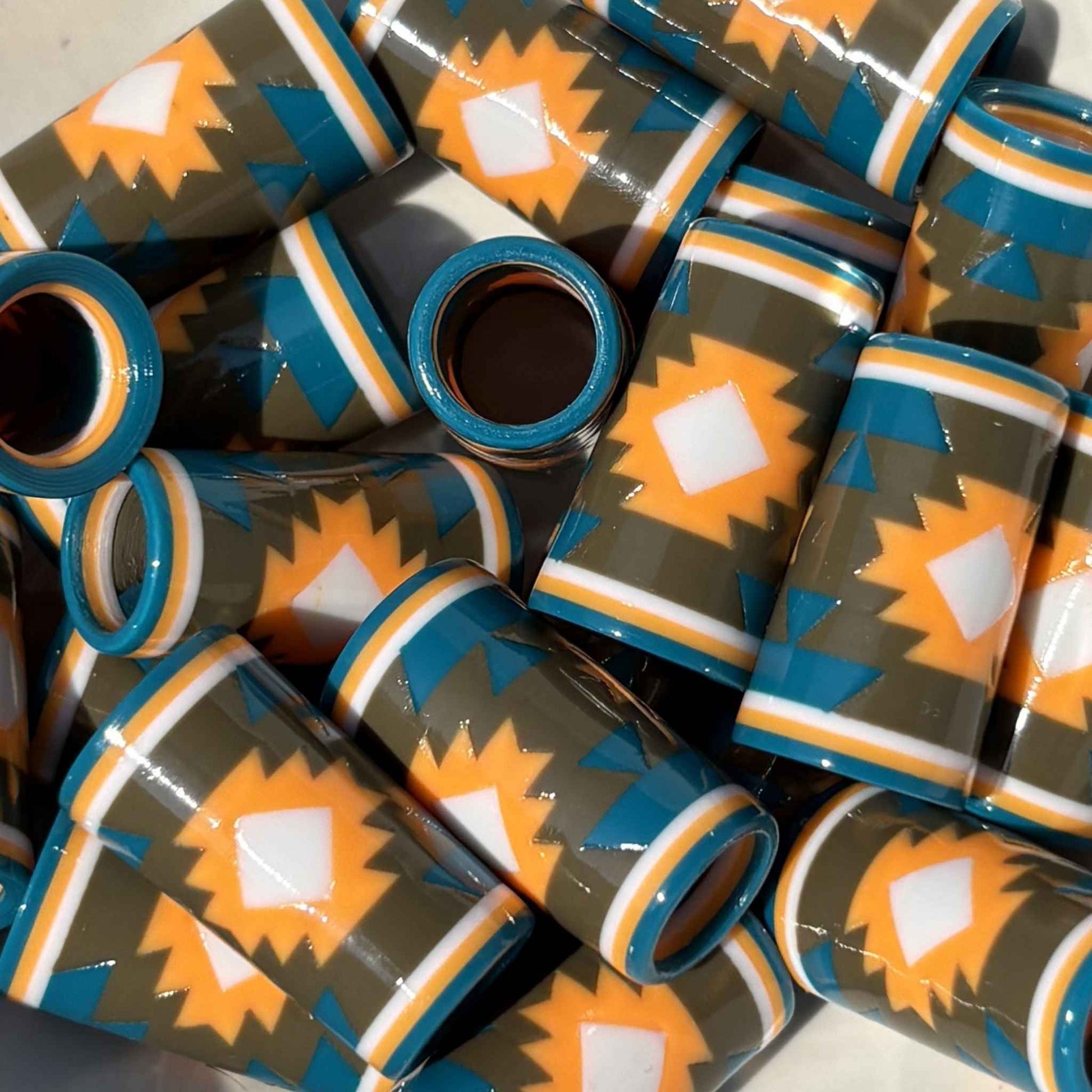blue, brown, orange, and white geometric patterned golf ferrules