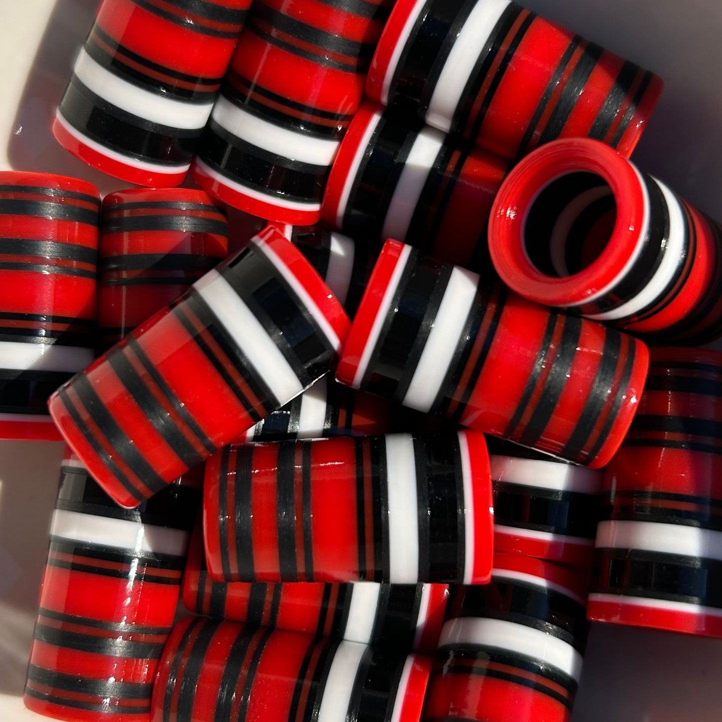 black, white, and red striped golf ferrules
