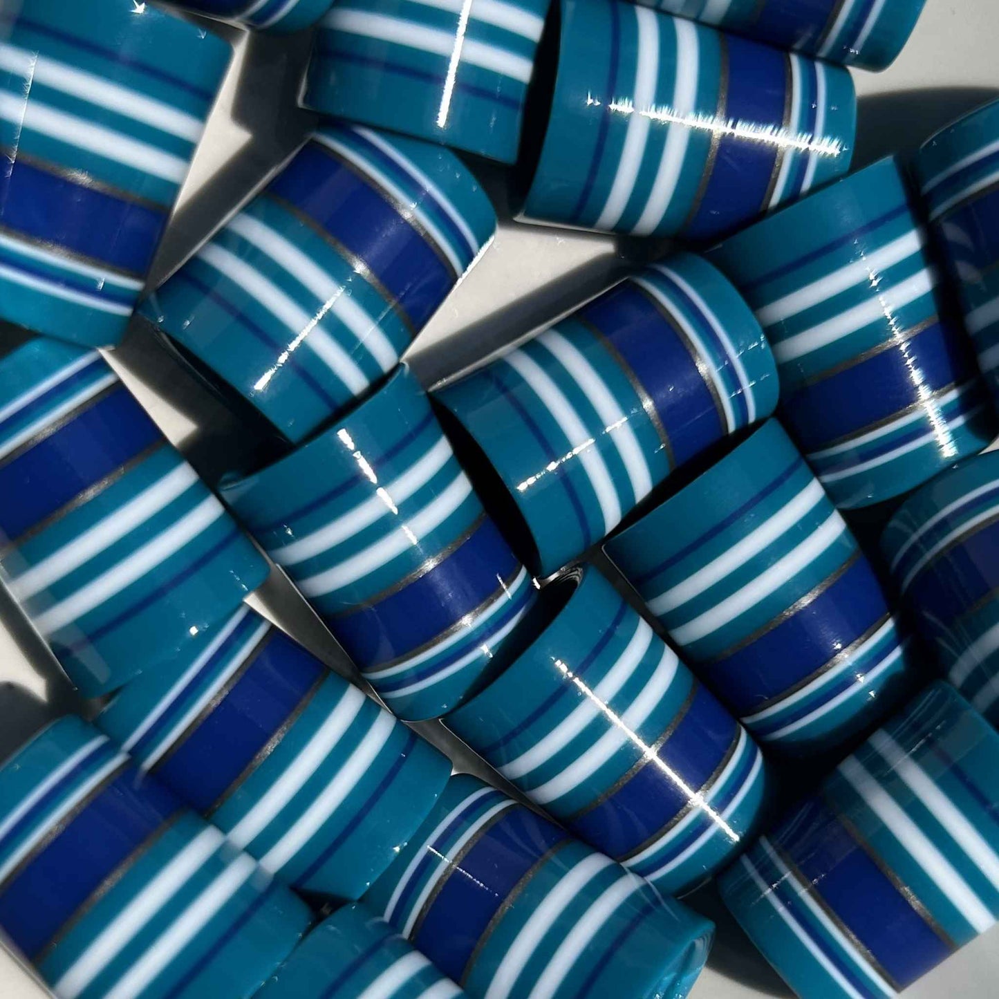 teal, blue, white, and silver shorty golf ferrules