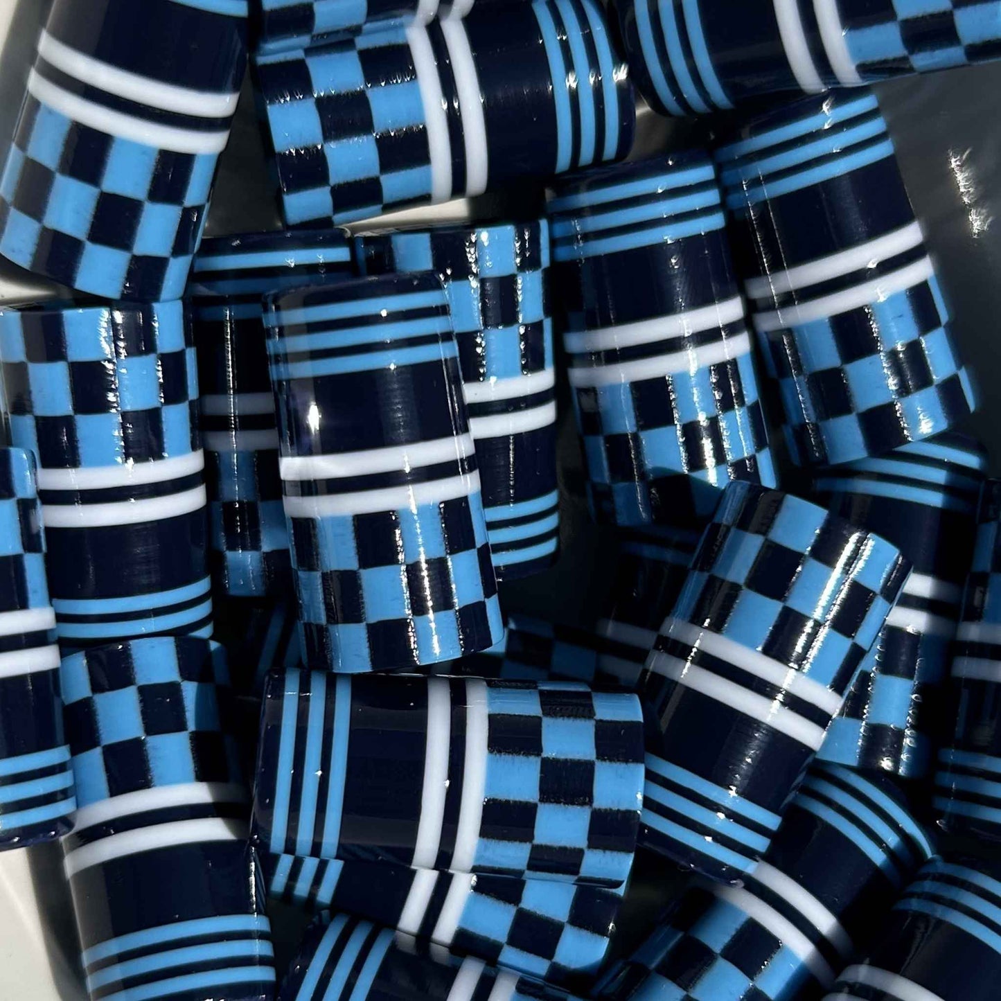 checker-patterned 3d-printed golf ferrules in navy, light blue, and white