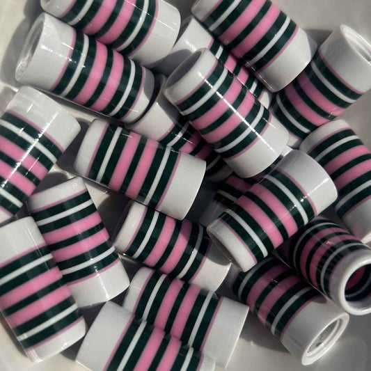green, pink, and white golf ferrules