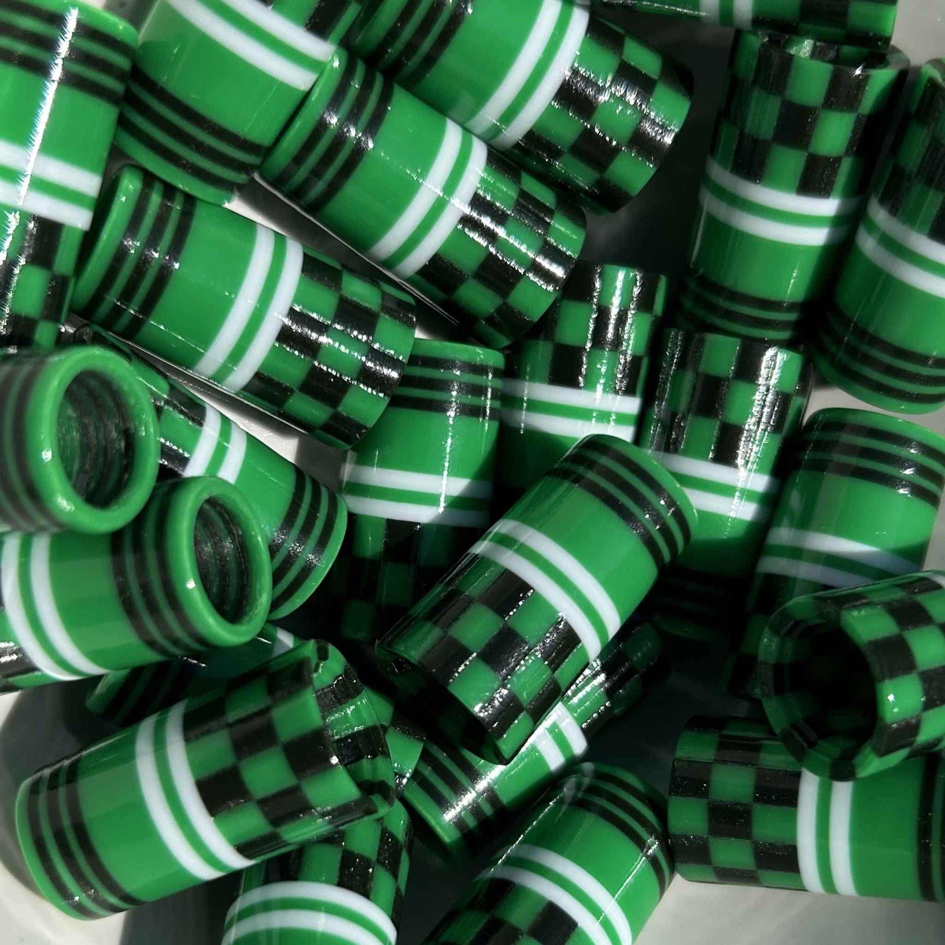 green, black, and white 3D-printed golf ferrules in a checkered pattern