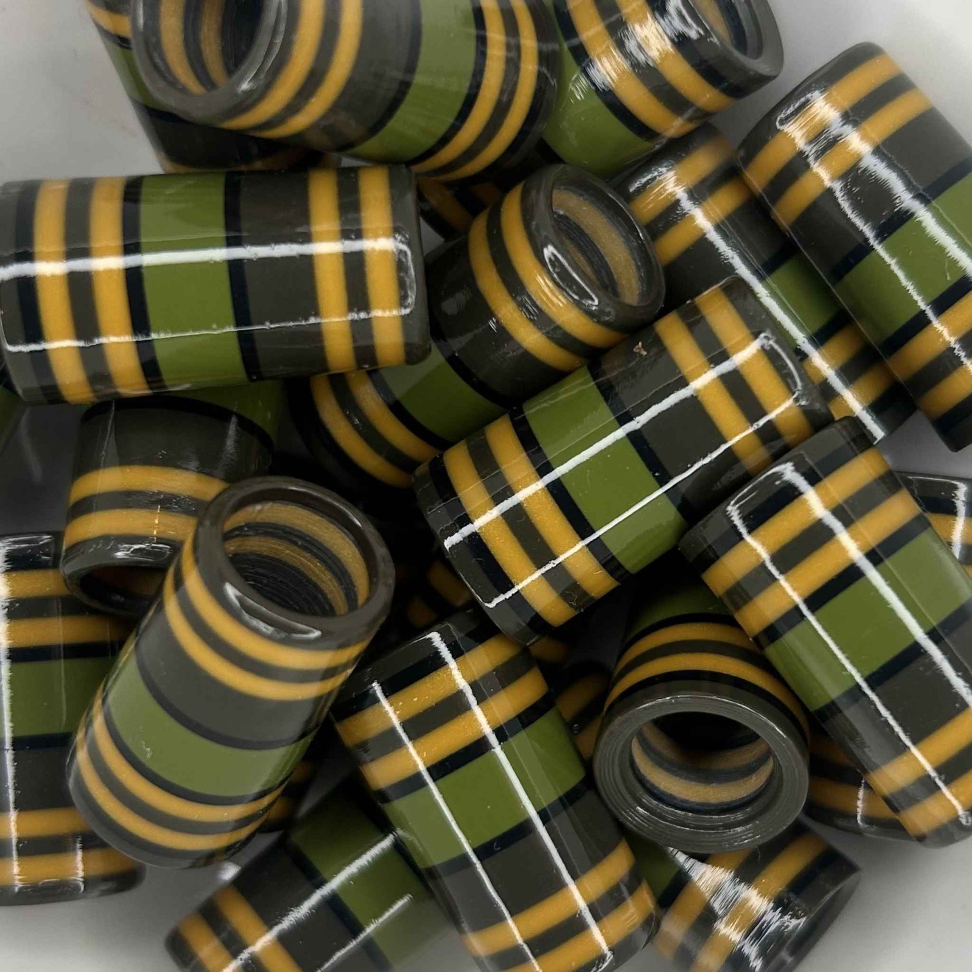 green, gray, gold, and black striped golf ferrules