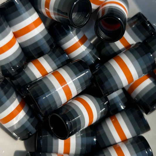 black, gray, white, and orange golf ferrules
