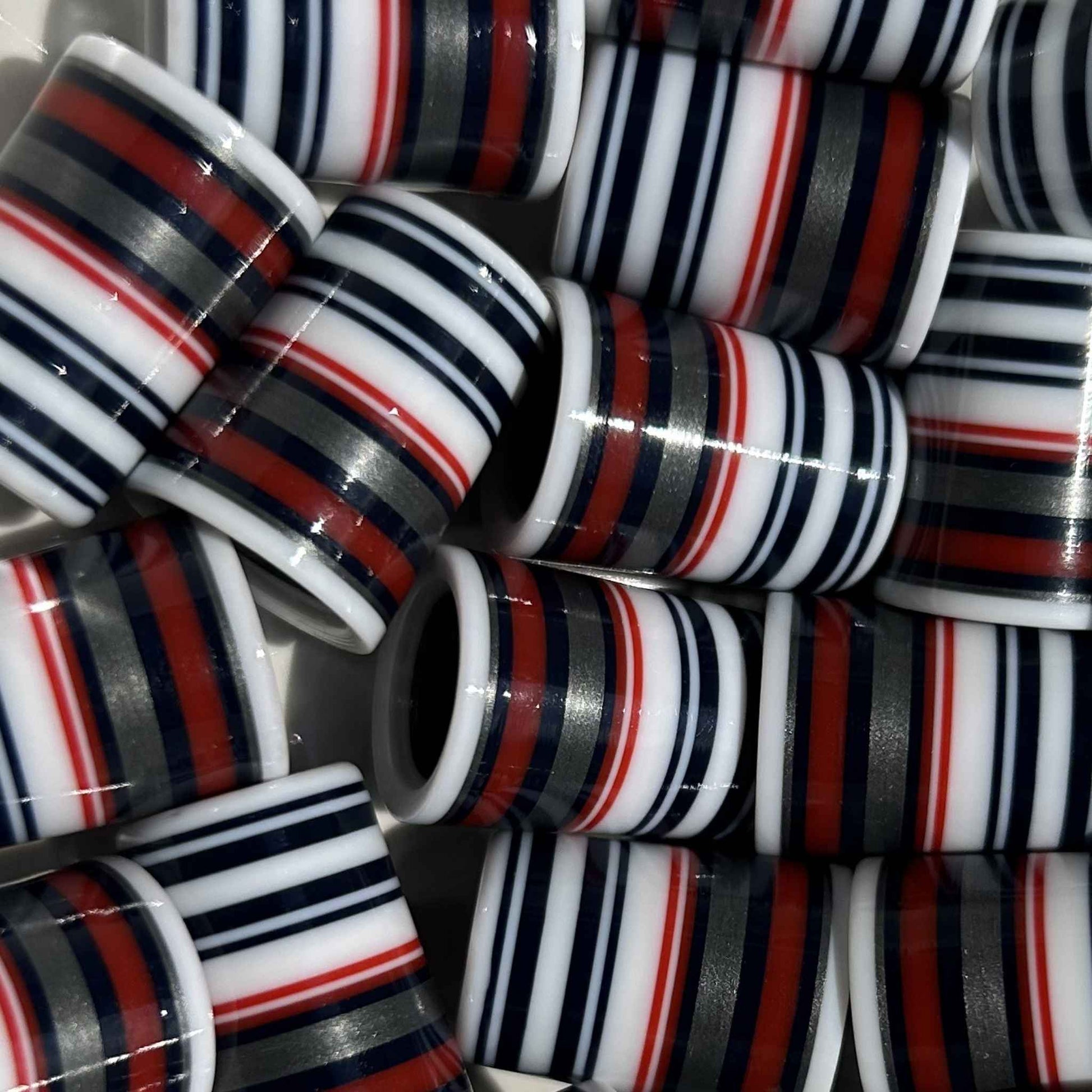 red, black, silver, and white golf ferrules