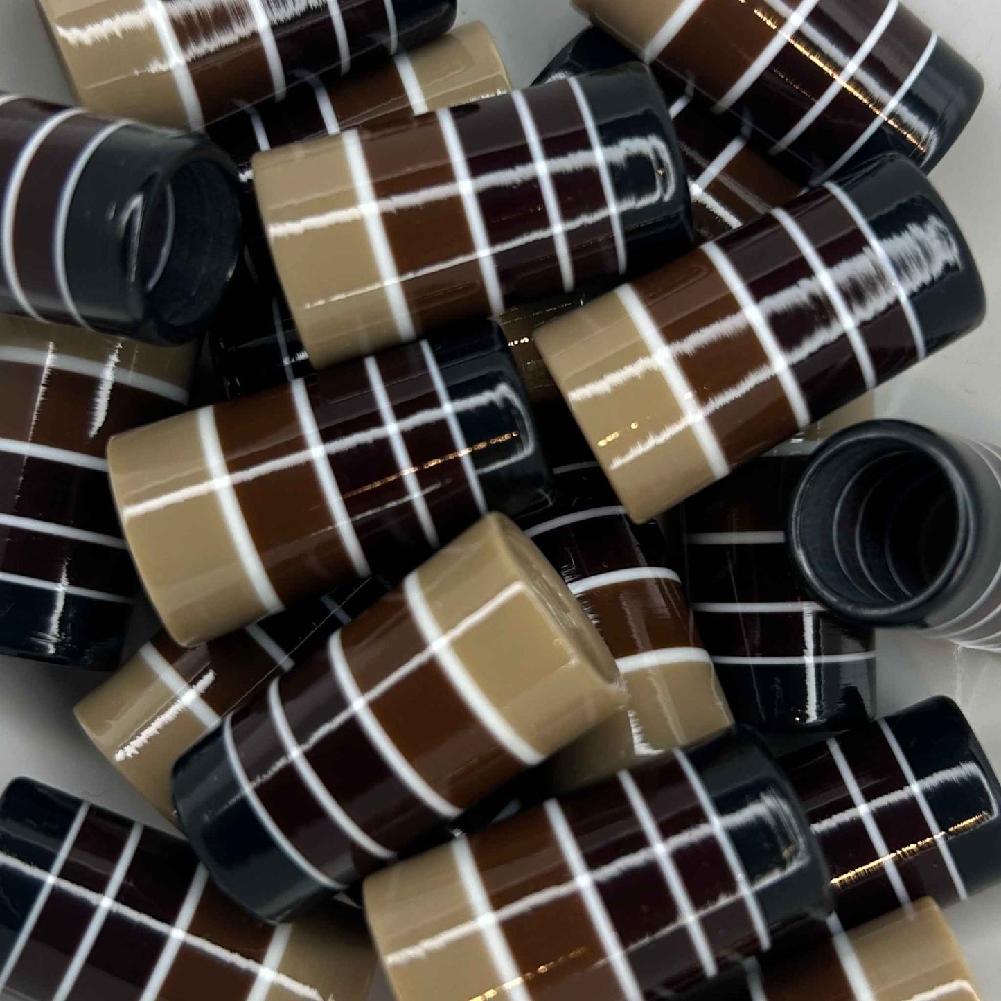 ombre golf ferrules, with a beige base to brown to dark brown to black, separated by thin white stripes