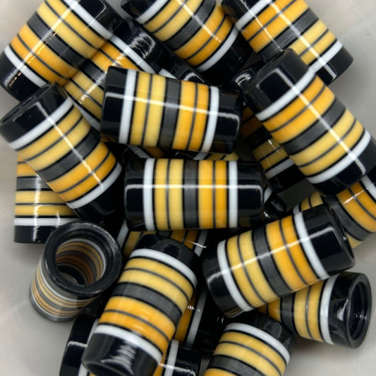 yellow-orange ombre golf ferrules with black, white, and silver stripes