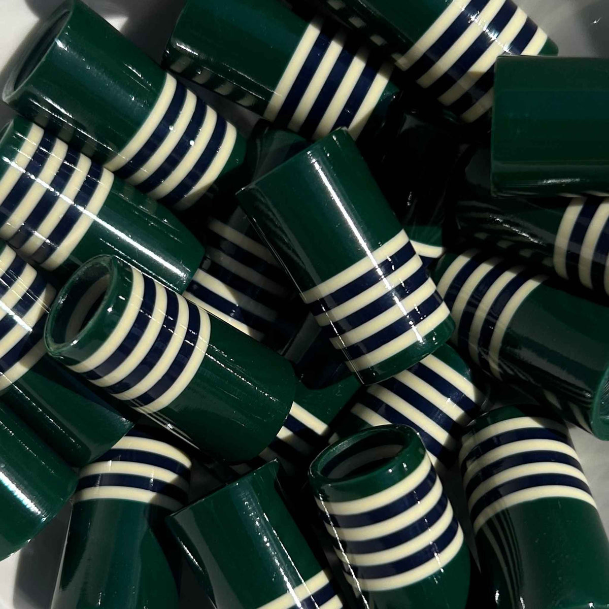 Green golf ferrules, 3D-printed with thin stripes at the top.