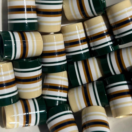 Beige, white, and forest green golf ferrules with gold accents.