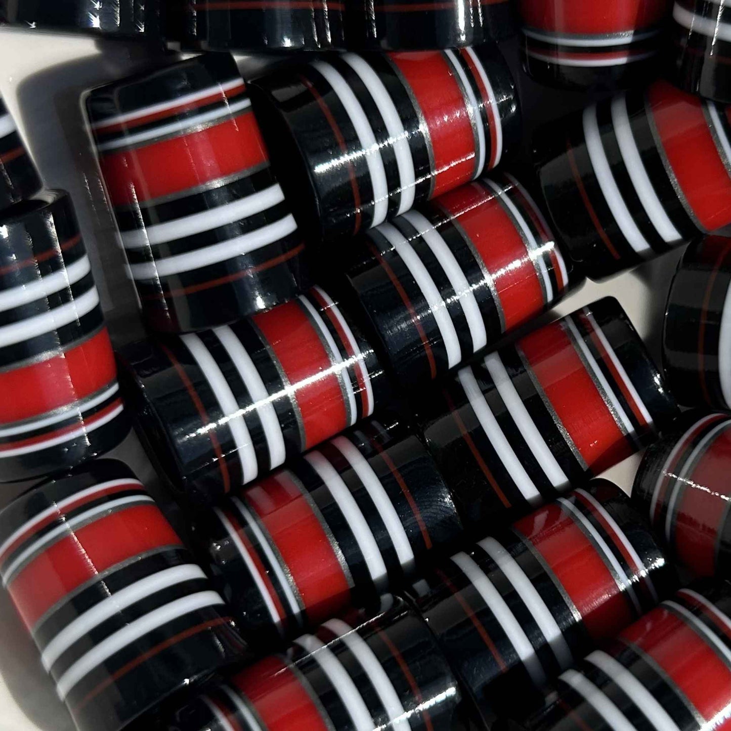 black, white, red, and silver golf ferrules in varying sizes of stripes