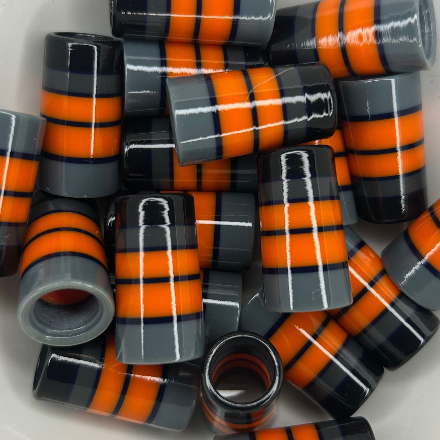 black, gray, and orange golf ferrules with thick stripes