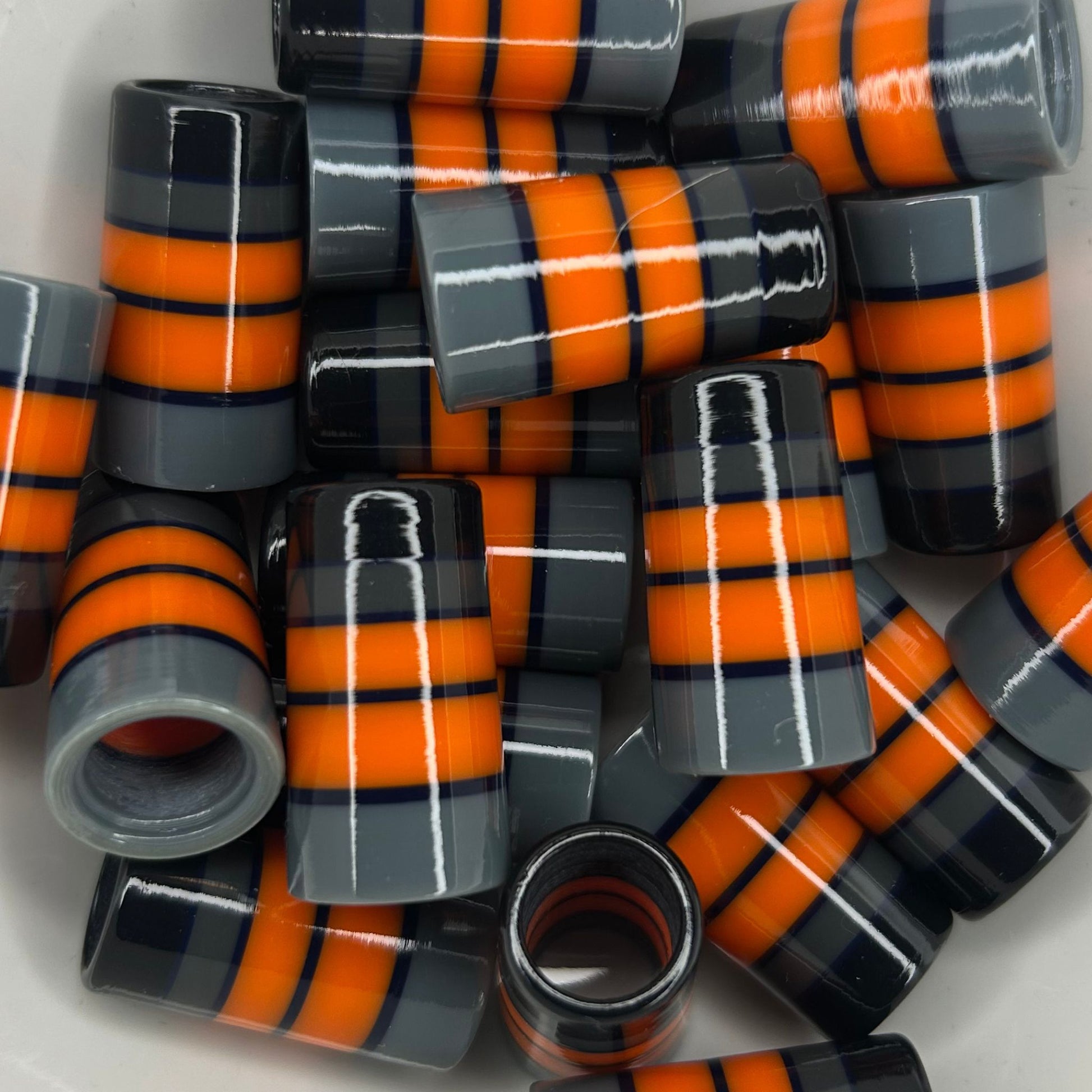 black, gray, and orange golf ferrules with thick stripes