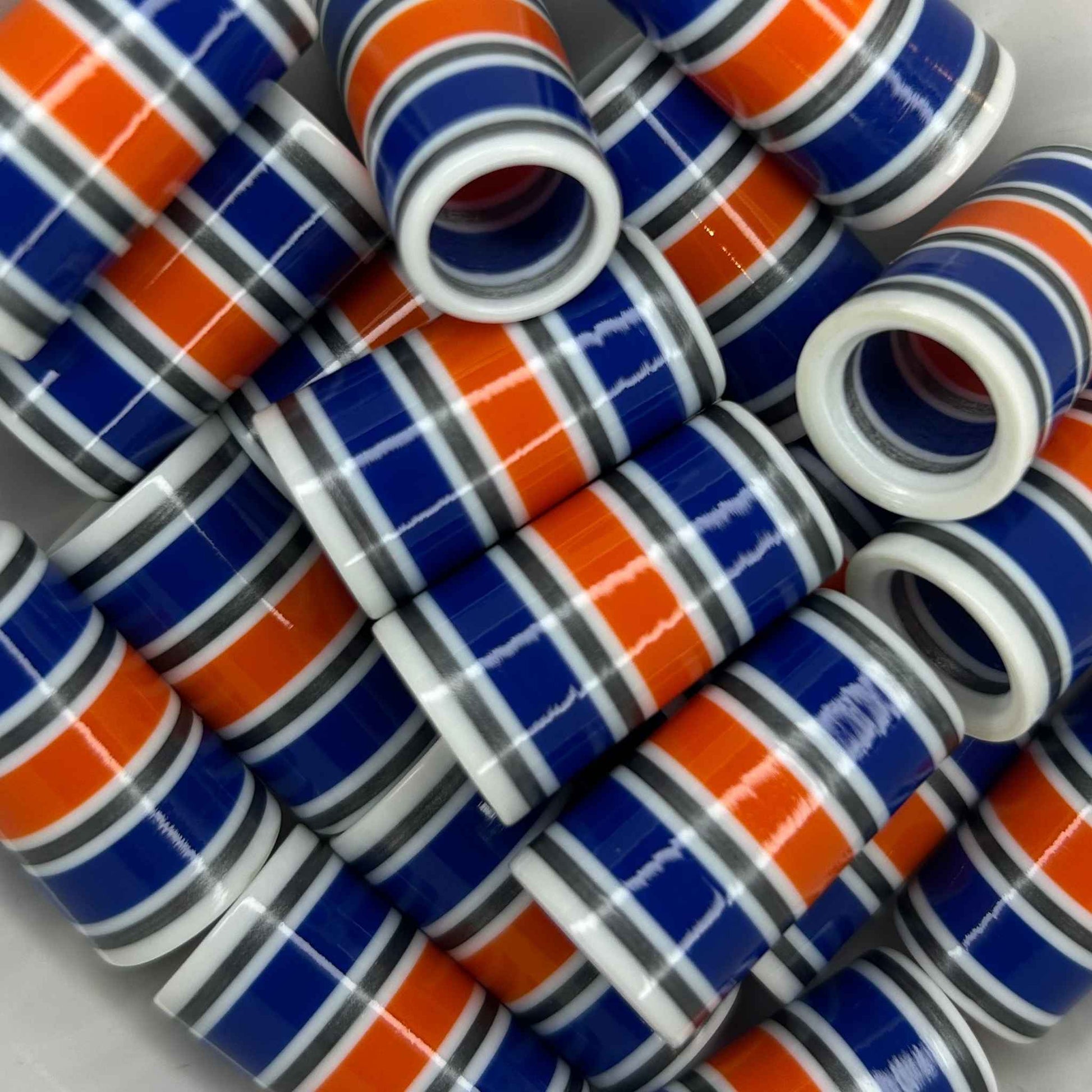white golf ferrules with blue, orange, and silver stripes