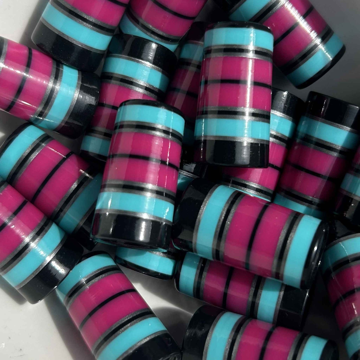 black, silver, teal, and magenta golf ferrules