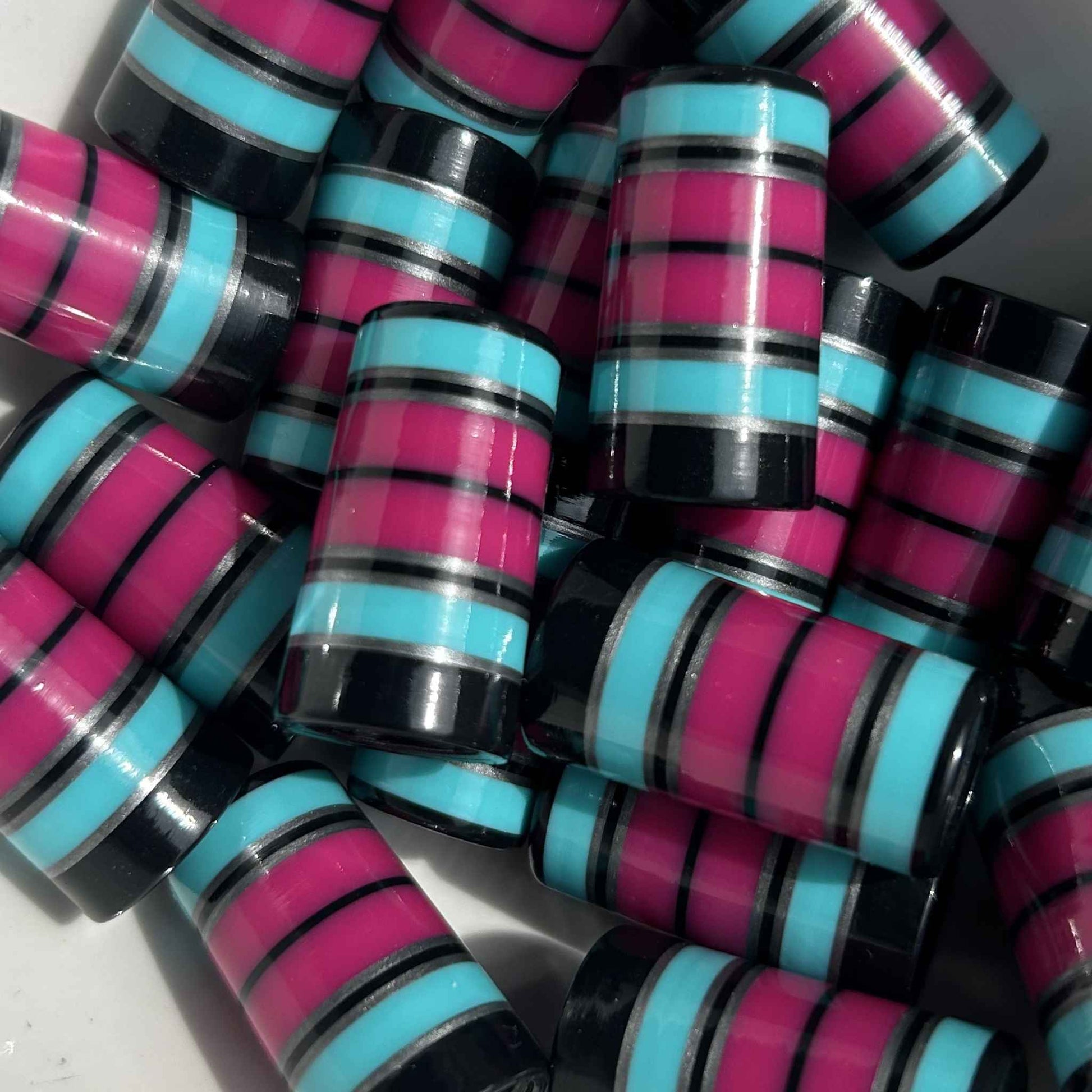 black, silver, teal, and magenta golf ferrules